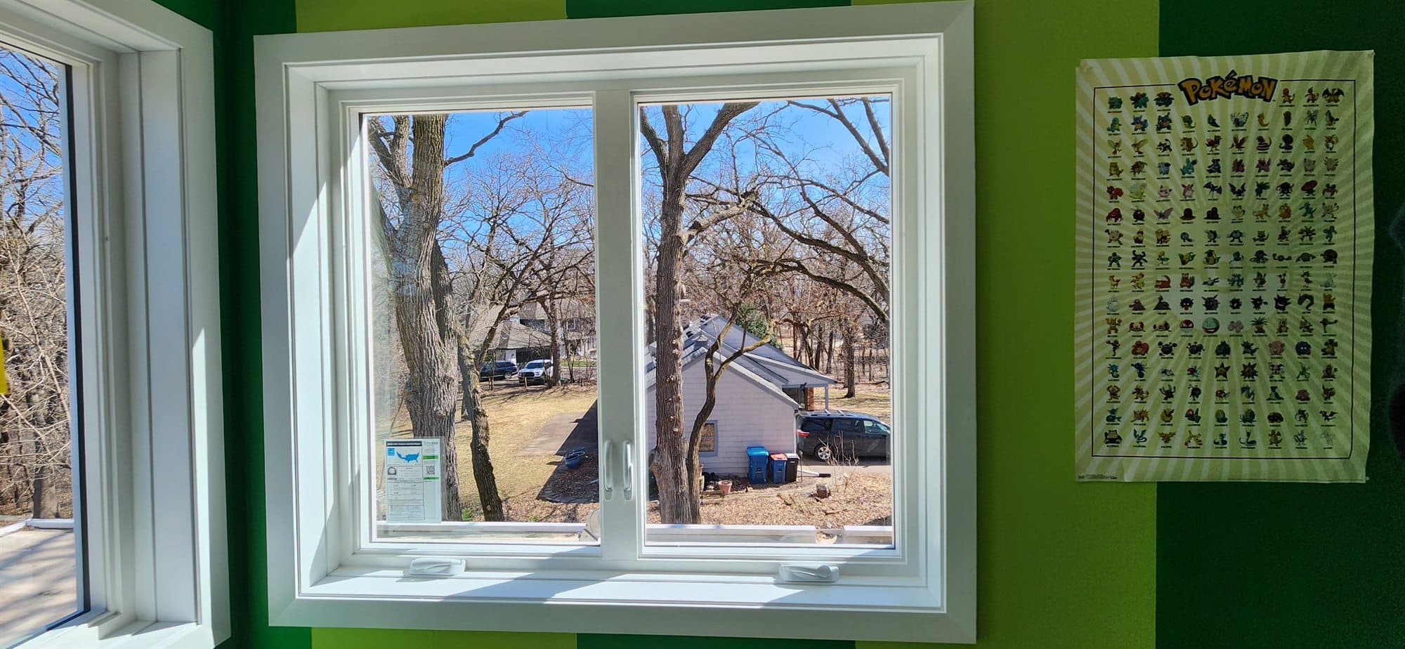 Pair of new white casement windows installed in a Minnesota home