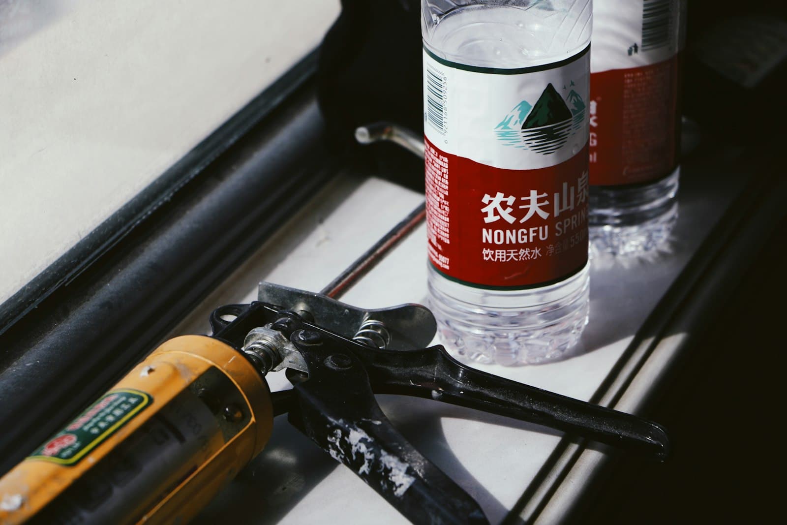 Caulk gun used to seal a window installation