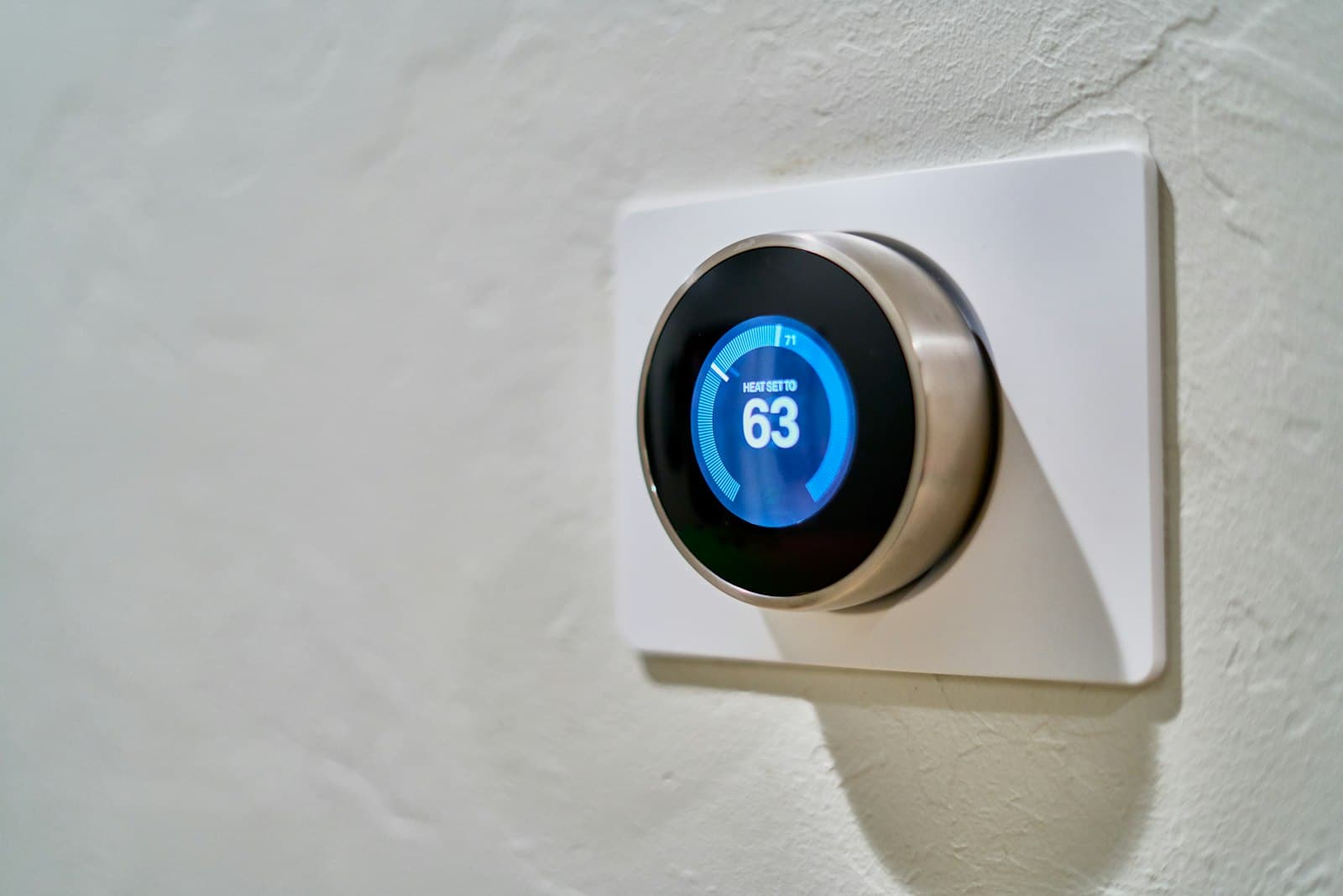 Smart thermostat displaying home temperature