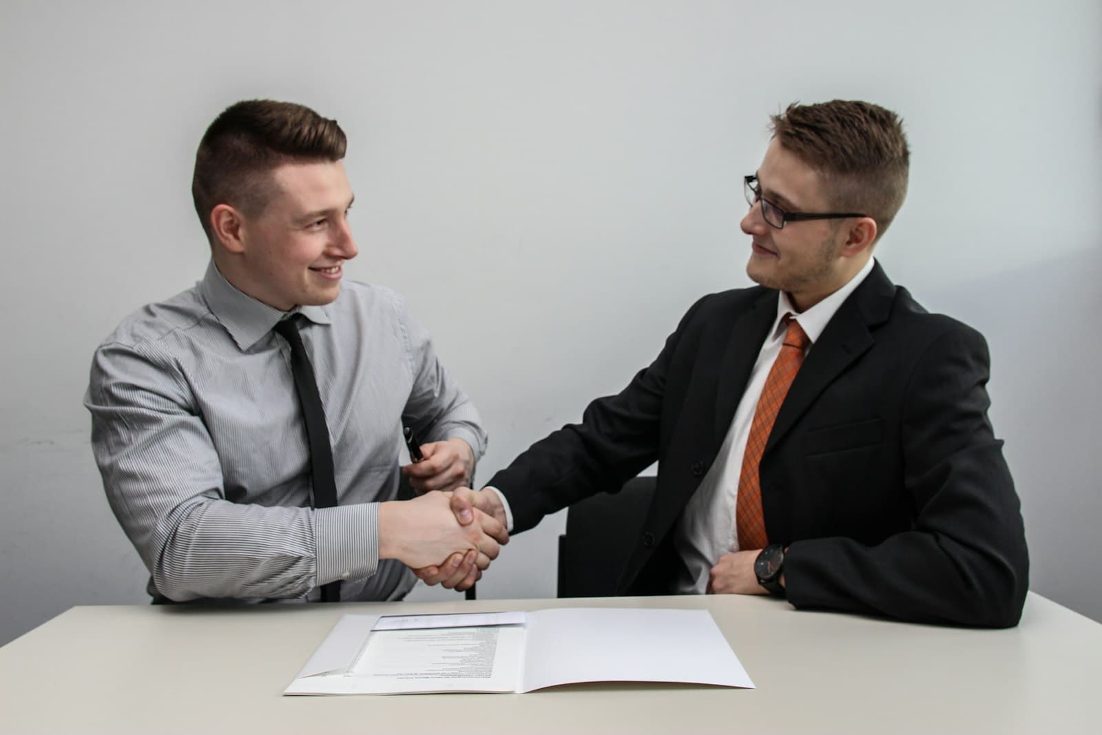 Contractor and homeowner shaking hands
