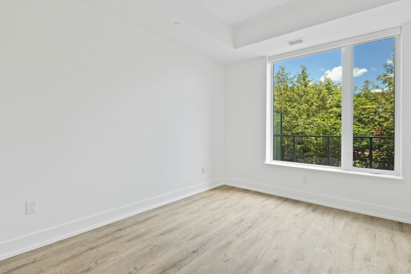 Bright white-framed window in a freshly finished room