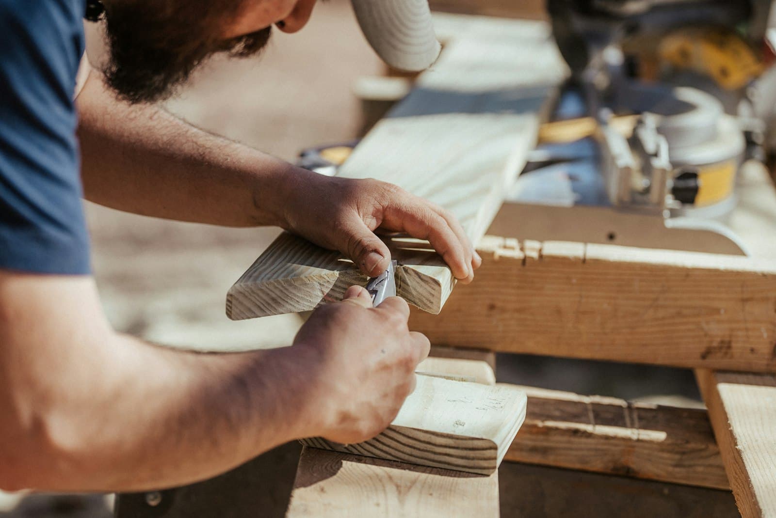 Carpenter working through installation steps on site