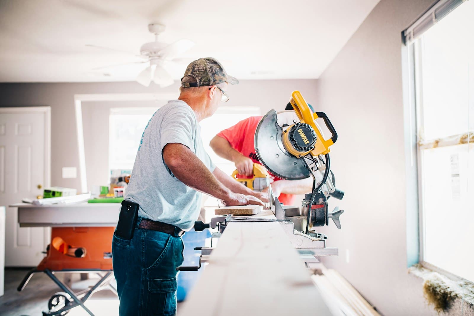 Professional installer working with a miter saw
